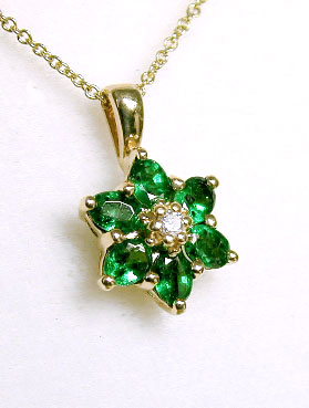 
Oval Emerald and Diamond Flower Pendant
